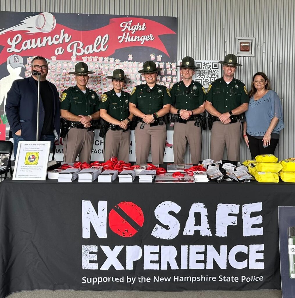 State Troopers behind a booth highlighting No Safe Experience - public relations